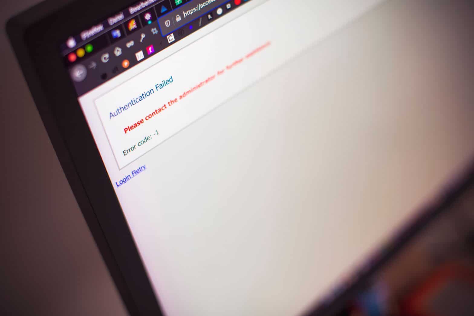 Close-up of a computer screen displaying an “Authentication Failed” login error message, illustrating cybersecurity risks, MFA issues, or phishing-related account access problems.