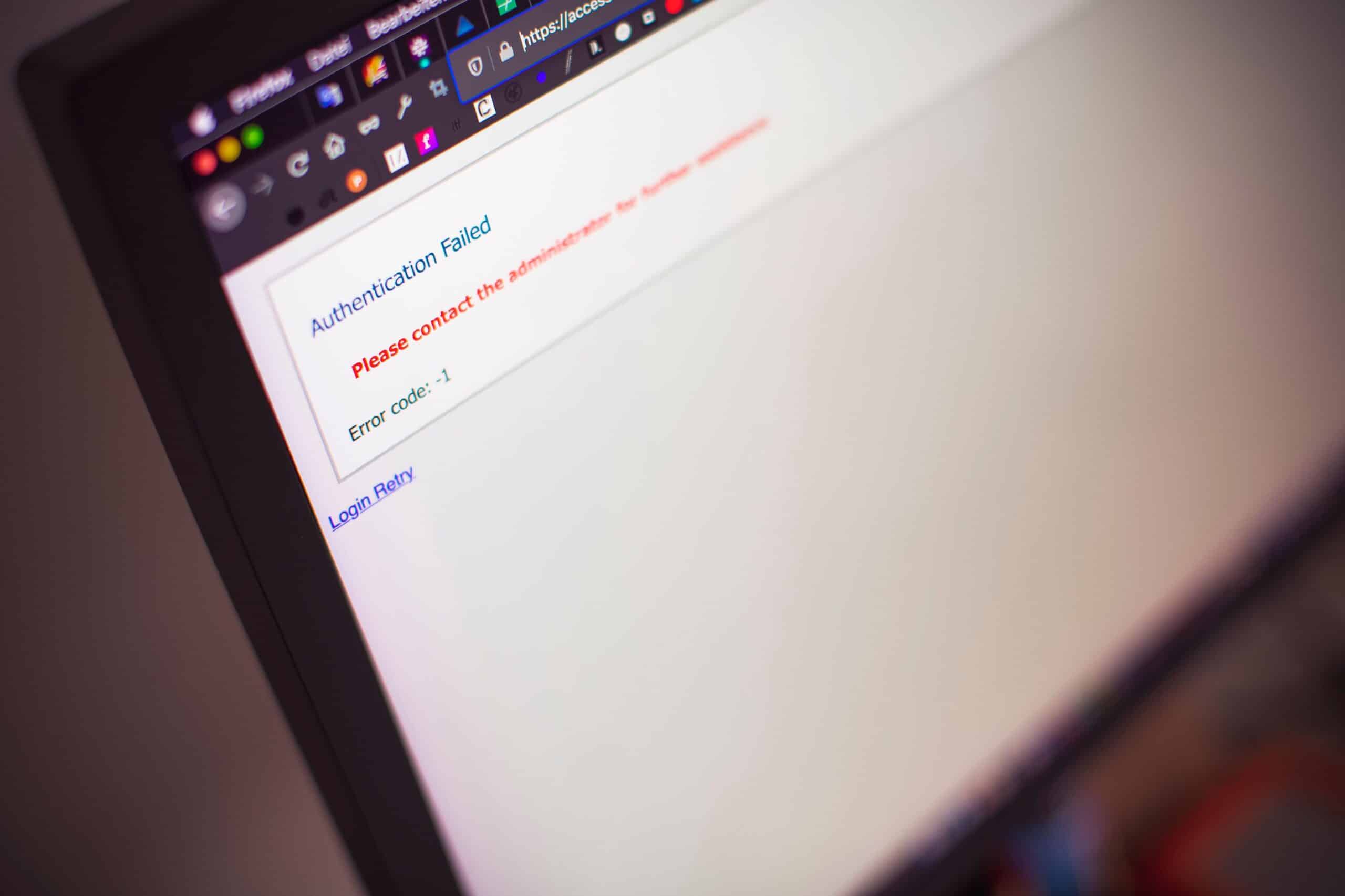 Close-up of a computer screen displaying an “Authentication Failed” login error message, illustrating cybersecurity risks, MFA issues, or phishing-related account access problems.